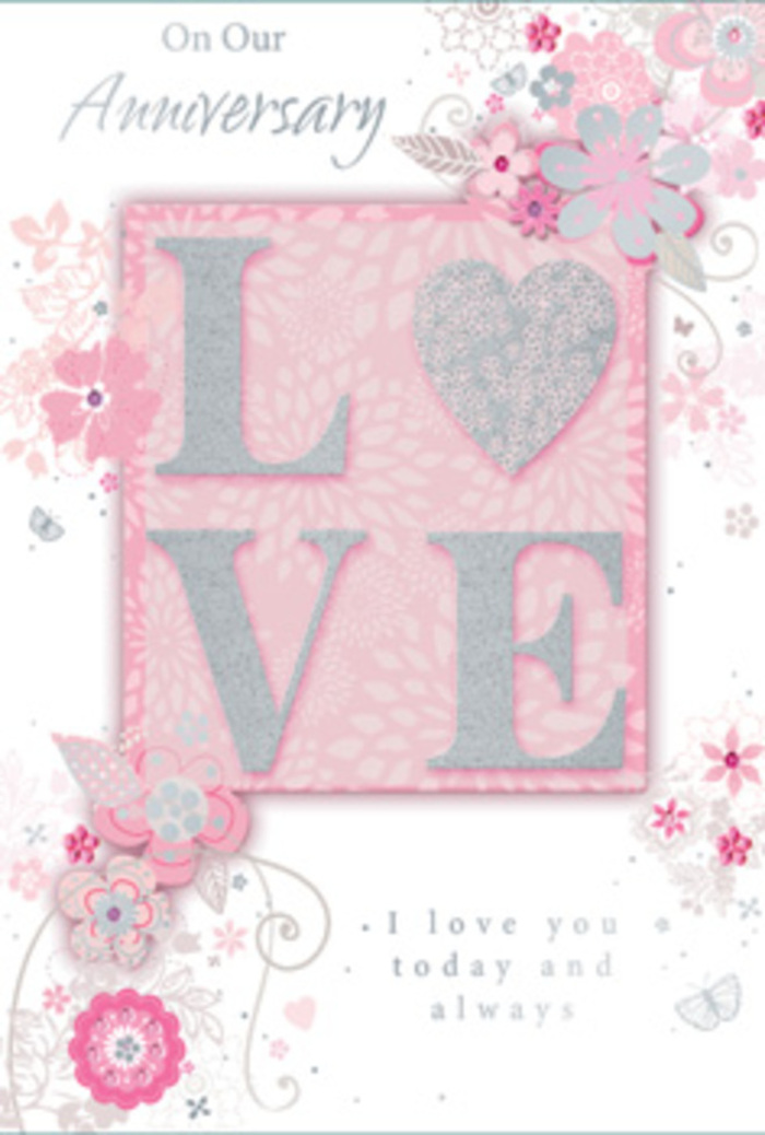 The anniversary card in this image unfolds like a gentle love story, its design built around the single word LOVE, which stands proudly at the centre in raised, frosted glitter that catches the light with a soft, romantic glow. Each letter feels carefully crafted, the textured surface inviting fingertips to trace its contours, not unlike the way you might linger over the velvety petals of pale pink roses from a Chingford florist. The central word is set against a delicate blush-pink rectangle, slightly deeper in tone than the rest of the card so it appears like a panel layered on top, adding depth and a subtle sense of occasion. Surrounding this motif, wispy, hand-drawn flowers drift across the surface in shades of blush, ivory, and soft grey, their petals open and airy, as if caught in a light spring breeze blowing in from Epping Forest. Fine tendrils, filigree lines, and tiny leaves weave between the blooms, giving the impression of a loosely sketched garland that might have inspired a real-life bouquet for delivery around Chingford Mount or Friday Hill. In some corners, almost-hidden butterflies and delicate curls of line work suggest the quiet flutter of hearts and the passing of time, while still keeping the design uncluttered and serene. The background remains a pale, warm pink, gently illuminated as if lit by soft afternoon light coming through a window. Nestled beneath the floral swirls is a graceful message celebrating enduring love, set in a flowing script that feels personal rather than formal. The overall mood is tender and reflective, like a hand-tied anniversary arrangement in card form, made to be treasured long after the day itself.